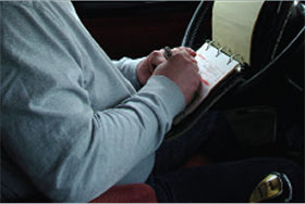 Image of a man taking notes